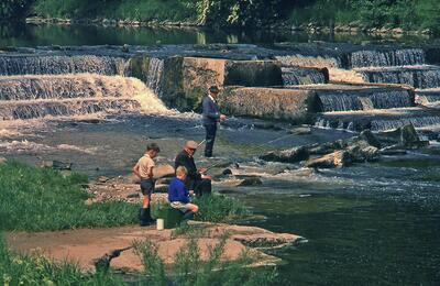 Low Mill weir with anglers